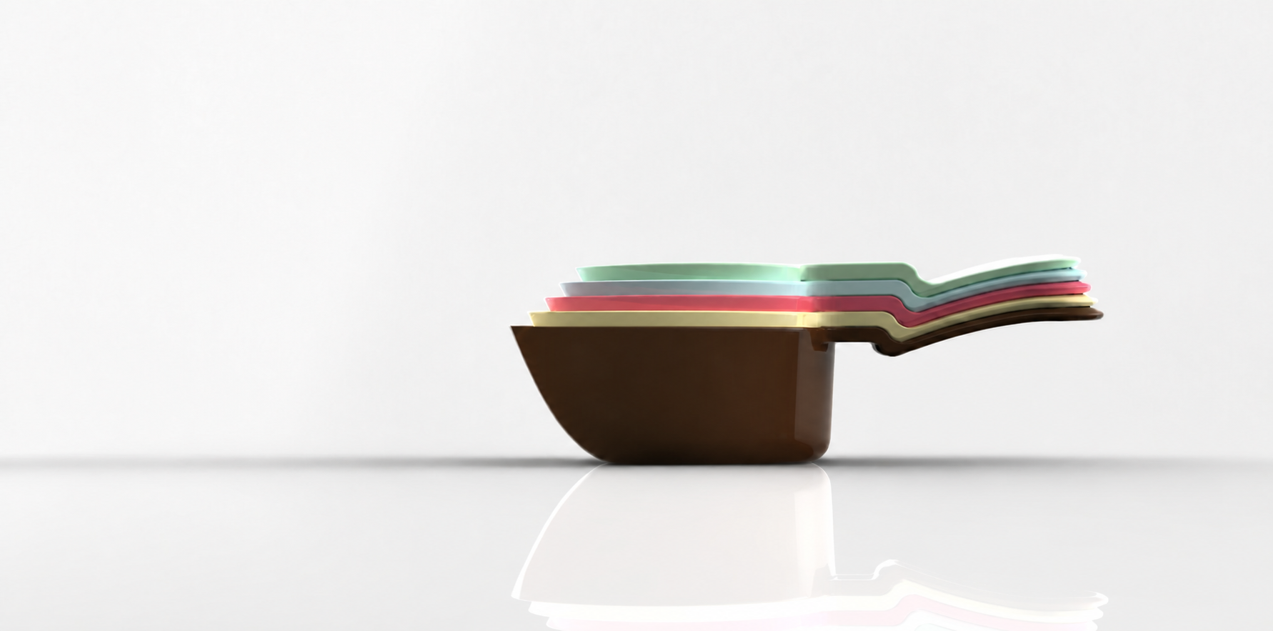 Stacked measuring cups with a straight tangent scoop wall and original rounded base